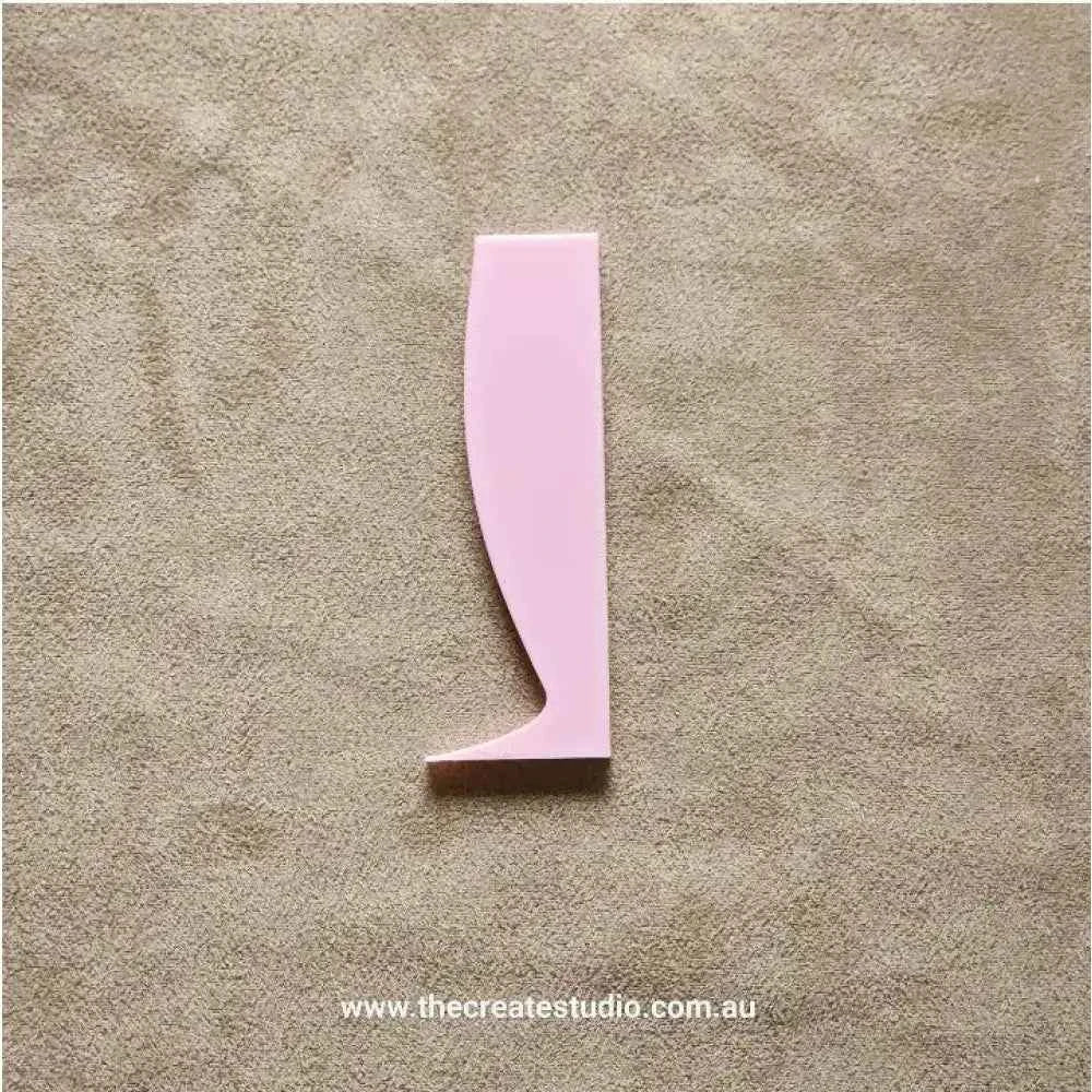 The Create Studio pottery rib tool set featuring a pink shaping tool for smoothing clay