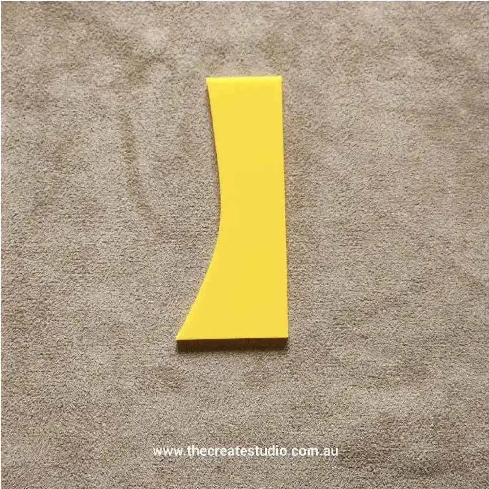 Yellow pottery rib tool set for shaping and smoothing clay surfaces