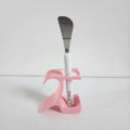 Pottery wheel tool holder in pink with a metal spatula for organized sculpting tools