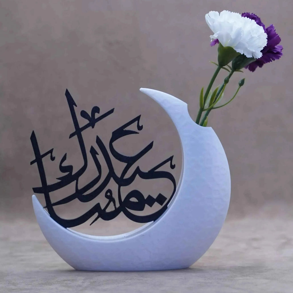 Stylish Ramadan table decor featuring a crescent moon design with a flower vase for festive gatherings