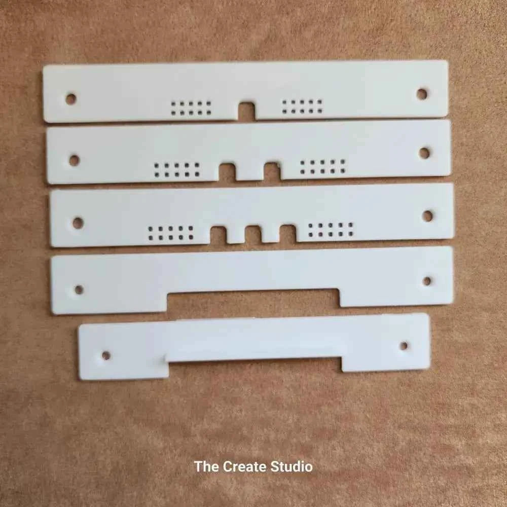 The Create Studio bee hive entrance reducer set of five white plastic adjustable entrance strips with ventilation holes