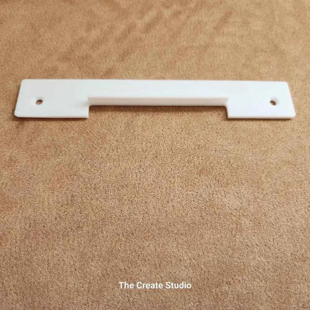 White plastic bee hive entrance reducer with centre slot and mounting holes by The Create Studio