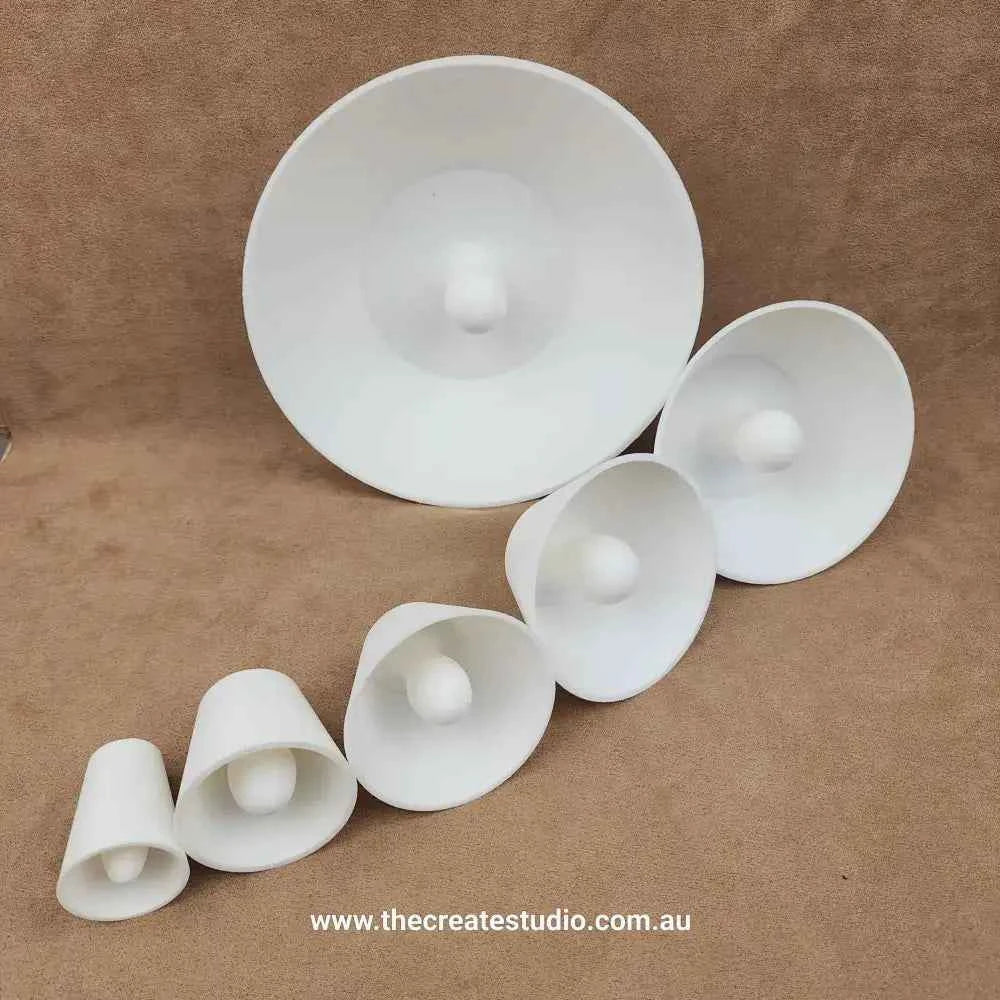 Set of white trimming tools pottery in various sizes for shaping and finishing clay projects