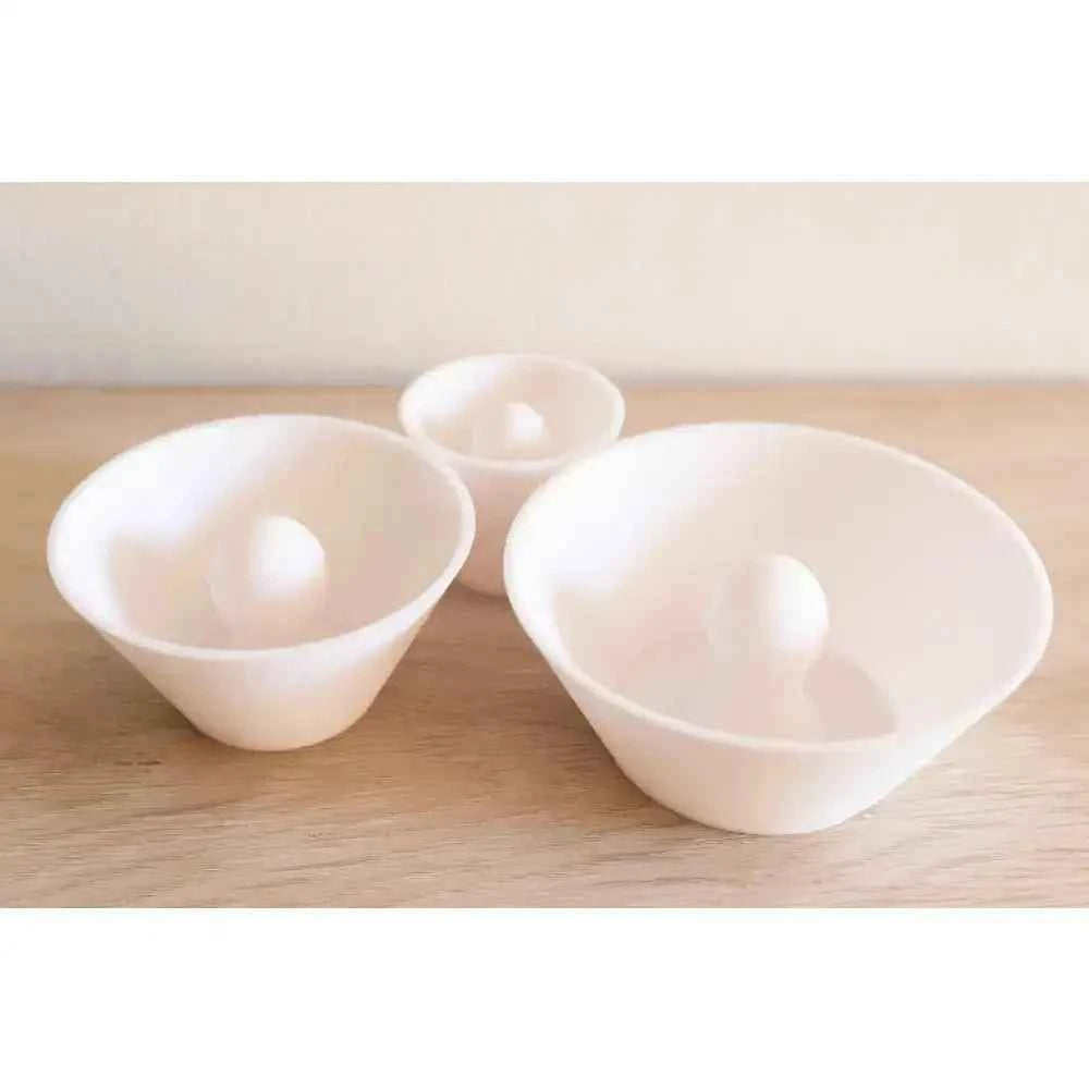 Set of three white ceramic trimming tools pottery with smooth surfaces for shaping clay