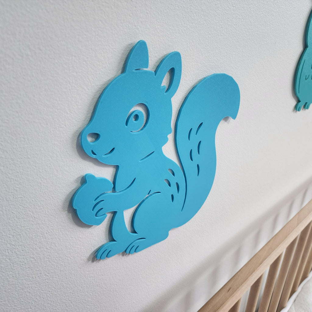 Blue squirrel wall decor from The Create Studio as woodland creature nursery decorations