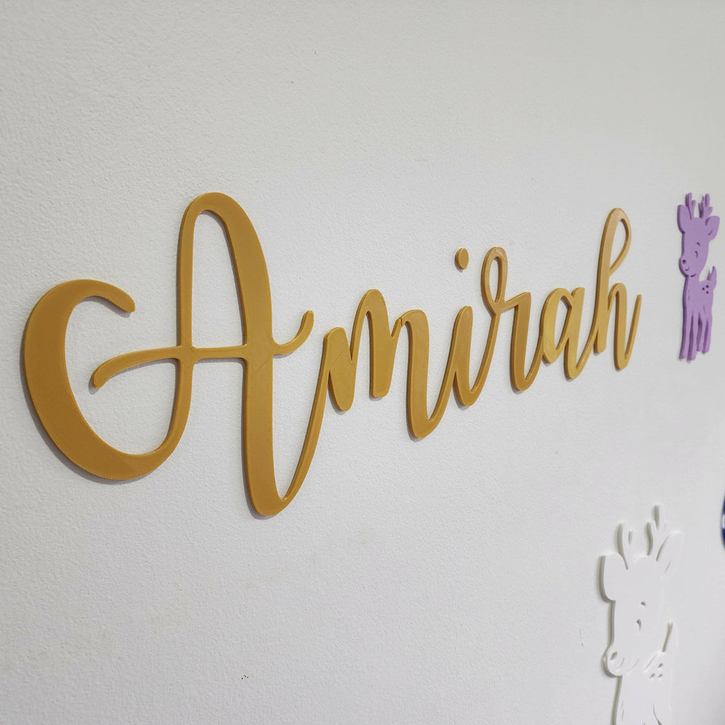 Yellow wooden name sign Amirah with purple and white giraffe woodland creature nursery decorations